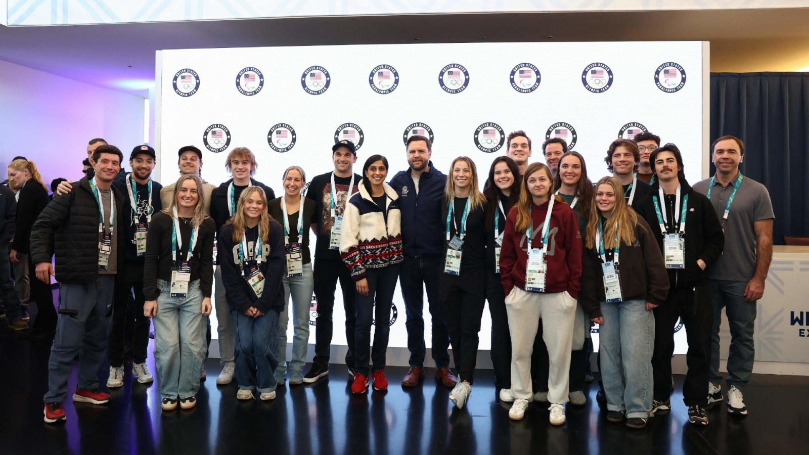 US Vice President JD Vance (CR) and Second Lady Usha Vance (CL) pose for a photo with Team USA athletes, at the Team USA Welcome Experience ahead of the Milano Cortina 2026 Winter Olympic Games in Milan on February 5, 2026. (Photo by Kevin Lamarque / POOL