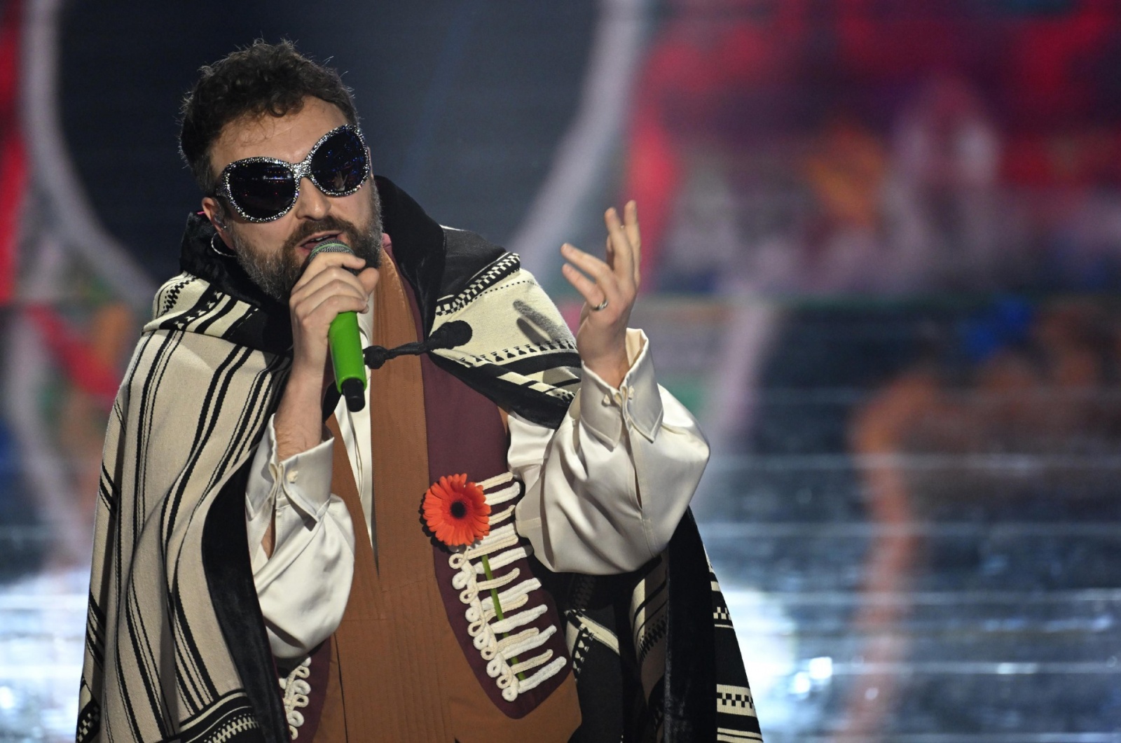 Italian singer Dargen D'Amico performs on stage at the Ariston theatre during the 76th edition of the Sanremo Italian Song Festival, in Sanremo, Italy, 25 February 2026. The music festival will run from 24 to 28 February 2026. ANSA/RICCARDO ANTIMIANI