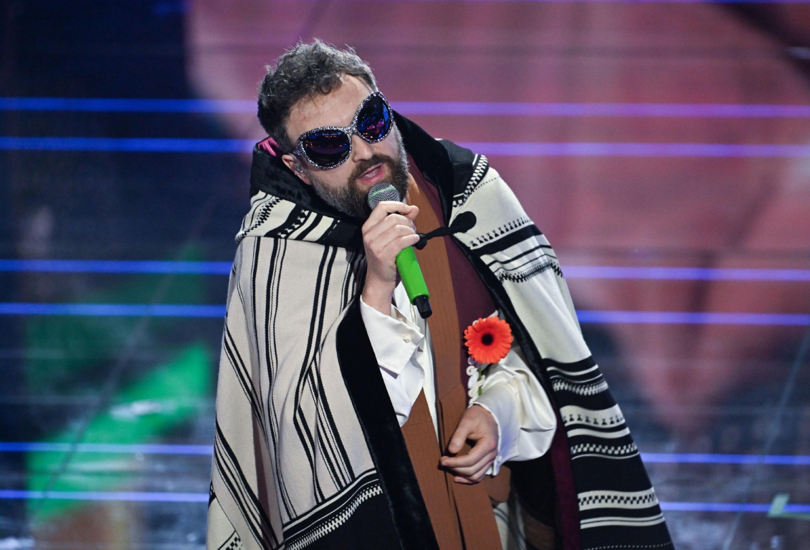 Italian singer Dargen D'Amico performs on stage at the Ariston theatre during the 76th edition of the Sanremo Italian Song Festival, in Sanremo, Italy, 25 February 2026. The music festival will run from 24 to 28 February 2026. ANSA/RICCARDO ANTIMIANI