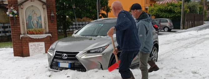Cislago: grandine e fiume in strada
